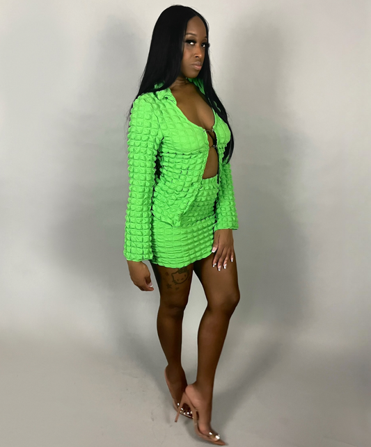green quilted top and mini skirt